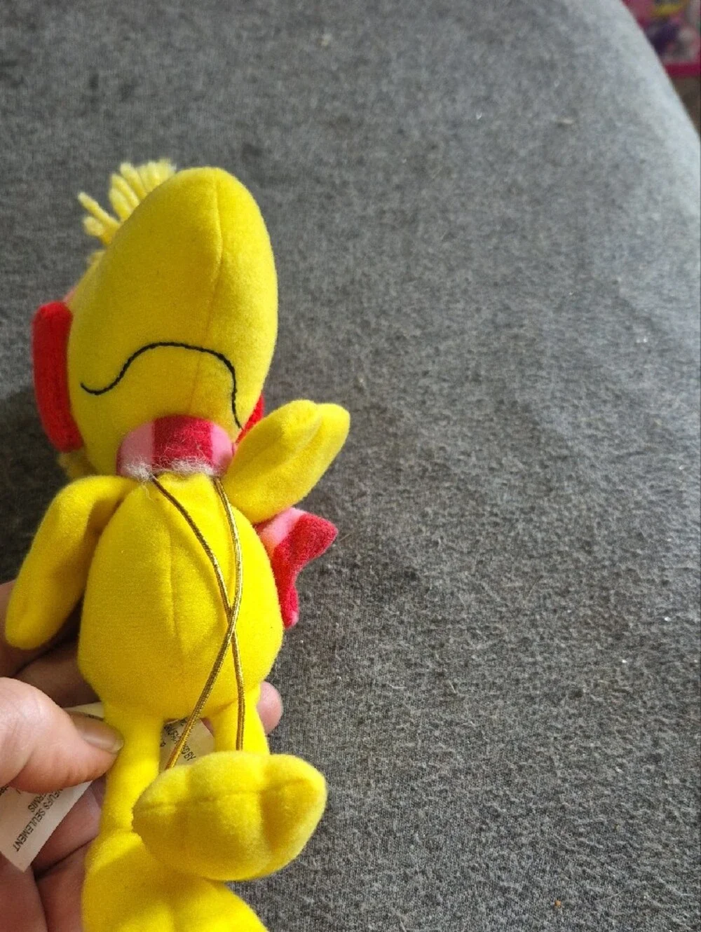 Peanuts Yellow Woodstock Plush with Pink Strap and Red Heart Earmuffs